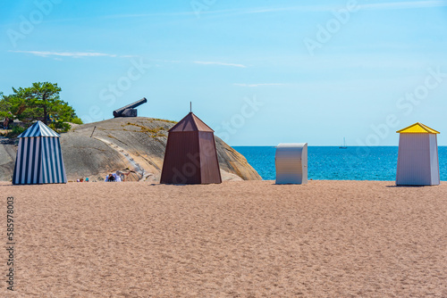 Wooden changing rooms at beach in Hanko, Finland photo