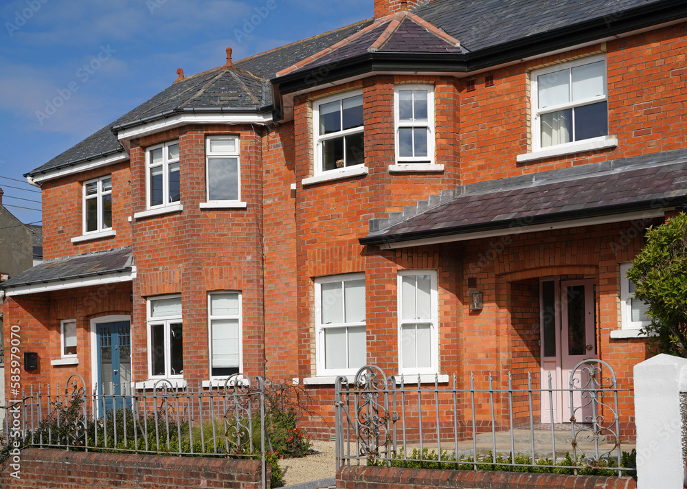 Row of traditional older semi-detached houses