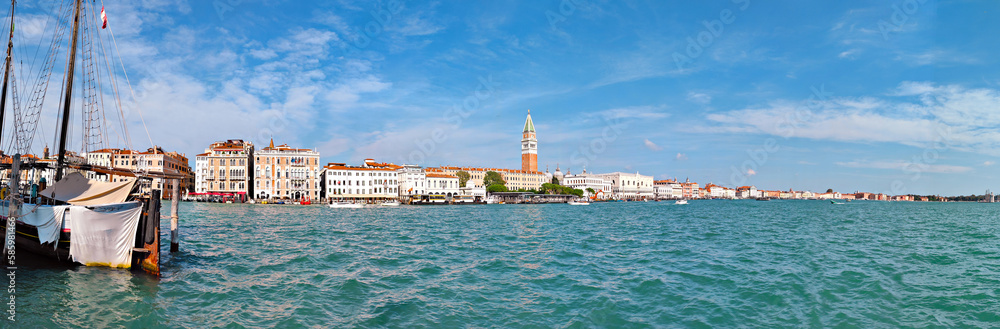 Panoramic view of central Venice from across the sea. This travel banner panorama features the stunning water in front of this Italian city.