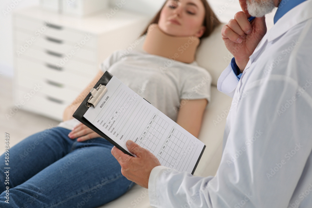 Doctor filling patient's medical card in clinic, closeup Doctor filling patient's medical card in clinic, closeup