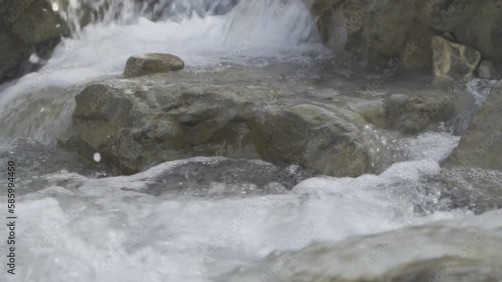 Closeup shot of rocky water stream Closeup shot of rocky water stream