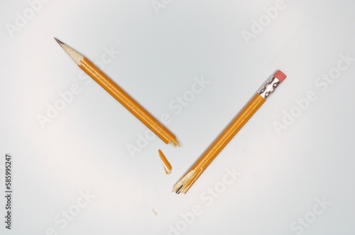 Close-up shot of a broken pencil on the white background photo