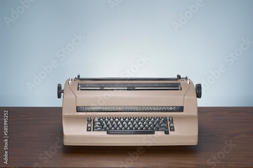 Closeup of a vintage typewriter on a wooden table