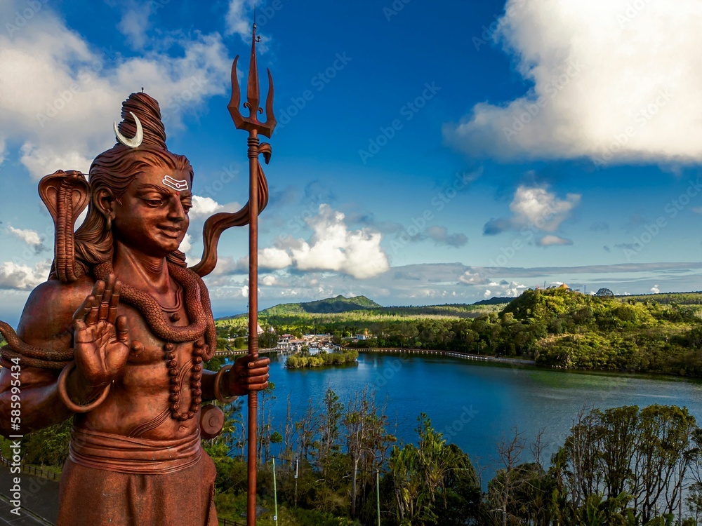 Fototapeta premium Shiv statue over the Grand Bassin lake in Mauritius.