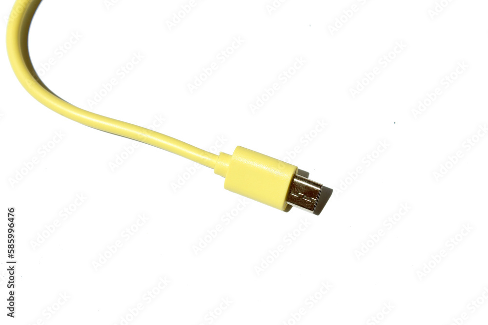 yellow USB cable on white background. USB and USB-mini cable connectors close-up. A patch cable or patch cord or patch lead. yellow USB cable on white background. USB and USB-mini cable connectors close-up. A patch cable or patch cord or patch lead.