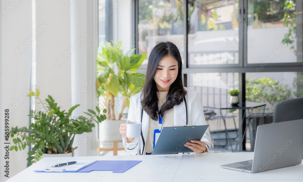 Business woman bookkeeper's use laptops doing account for paying taxes in the working office Business woman bookkeeper's use laptops doing account for paying taxes in the working office