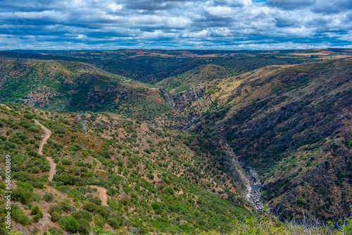 Barren valley surrounding confluence of Huebra and Camaces rivers in Spain photo