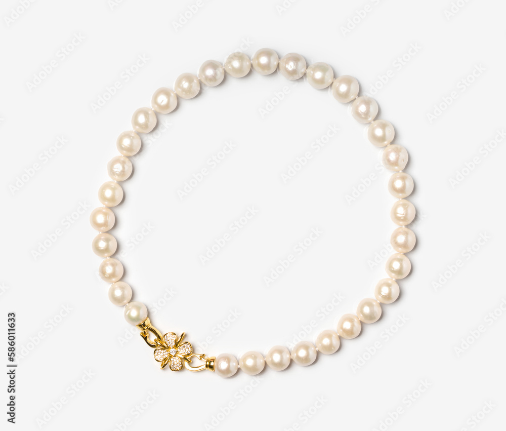 Freshwater pearl bracelet with gold hook and diamonds on white background. Collection of luxury jewelry accessories. Studio shot Freshwater pearl bracelet with gold hook and diamonds on white background. Collection of luxury jewelry accessories. Studio shot