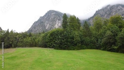 Aerial reveal view of Lake Lucerne Neuschwanstein Castle and the Swiss Alps