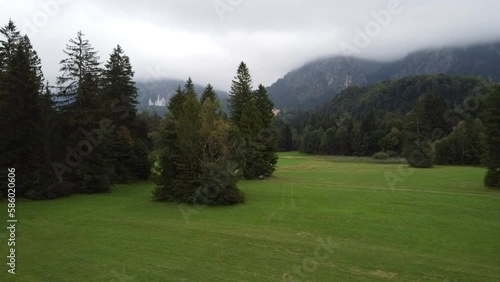 Aerial reveal view of Lake Lucerne Neuschwanstein Castle and the Swiss Alps