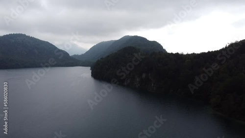 Aerial reveal view of Lake Lucerne Neuschwanstein Castle and the Swiss Alps