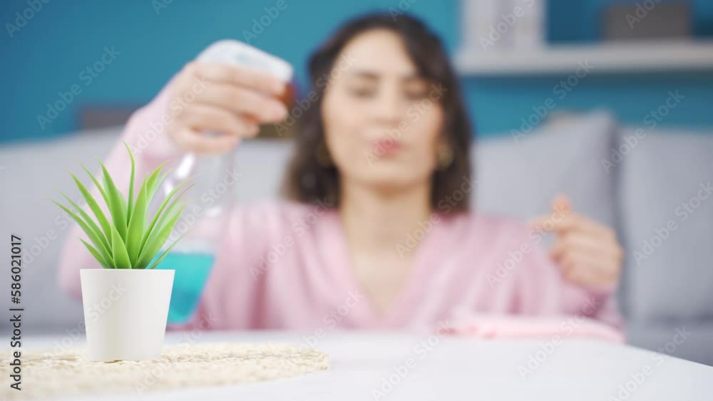 Germ and bacteria cleaning.
Young woman wipes the table full of germs and bacteria at home and is happy.
Germ and bacteria cleaning.
Young woman wipes the table full of germs and bacteria at home and is happy.