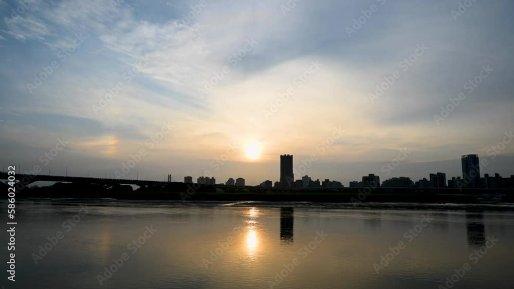 Romantic sunset view. Beautiful reflection of the silhouette in the river. Historic sights and trendy famous tourist attractions. Dadaocheng Wharf, Taipei, Taiwan Romantic sunset view. Beautiful reflection of the silhouette in the river. Historic sights and trendy famous tourist attractions. Dadaocheng Wharf, Taipei, Taiwan