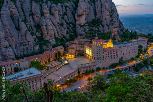 Sunset panorama view of Santa Maria de Montserrat abbey in Spain photo