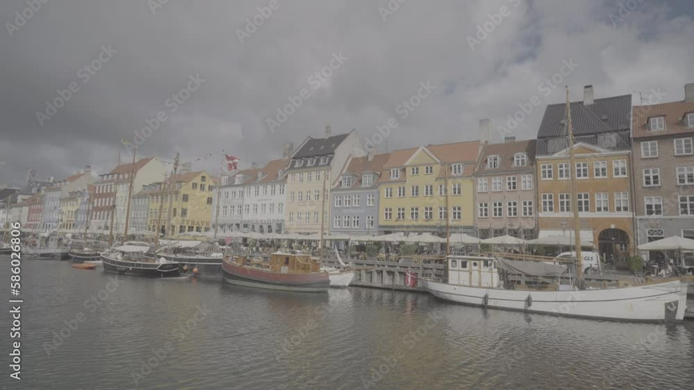Overview shot of Nyhavn street in Copehagen Denmark on a cloudy day LOG