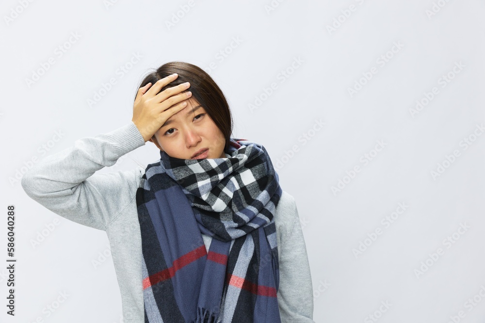 Asian woman cold flu raised hands from headache with fever sick from virus on white background, copy space Asian woman cold flu raised hands from headache with fever sick from virus on white background, copy space