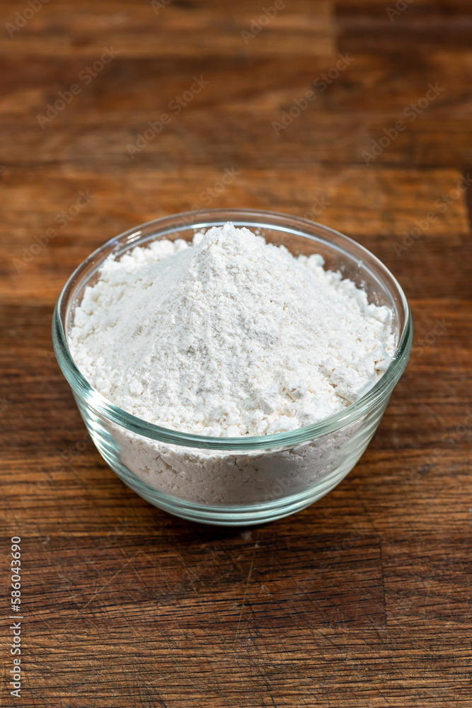 bowl of flour dough on a wooden surface. Cooking bread. Kneading the Dough. Long banner format bowl of flour dough on a wooden surface. Cooking bread. Kneading the Dough. Long banner format