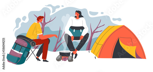 Camping man and woman sitting by fire and tent