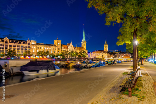 Sunset view of historic Zuerich city center with famous Fraumuenster Church and river Limmat on a sunny day, Switzerland photo