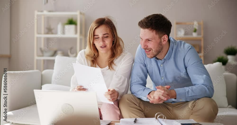 Shocked Couple Reading Bad News Letter Shocked Couple Reading Bad News Letter