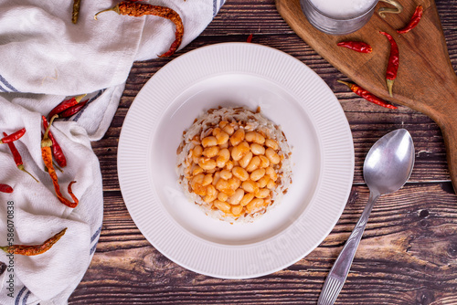 Dry bean pilaf. Prepared with the perfect harmony of dry beans and rice, this dish is both nutritious and satisfying. Traditional Turkish cuisine. Local name kuru fasulye pilav. Top view photo