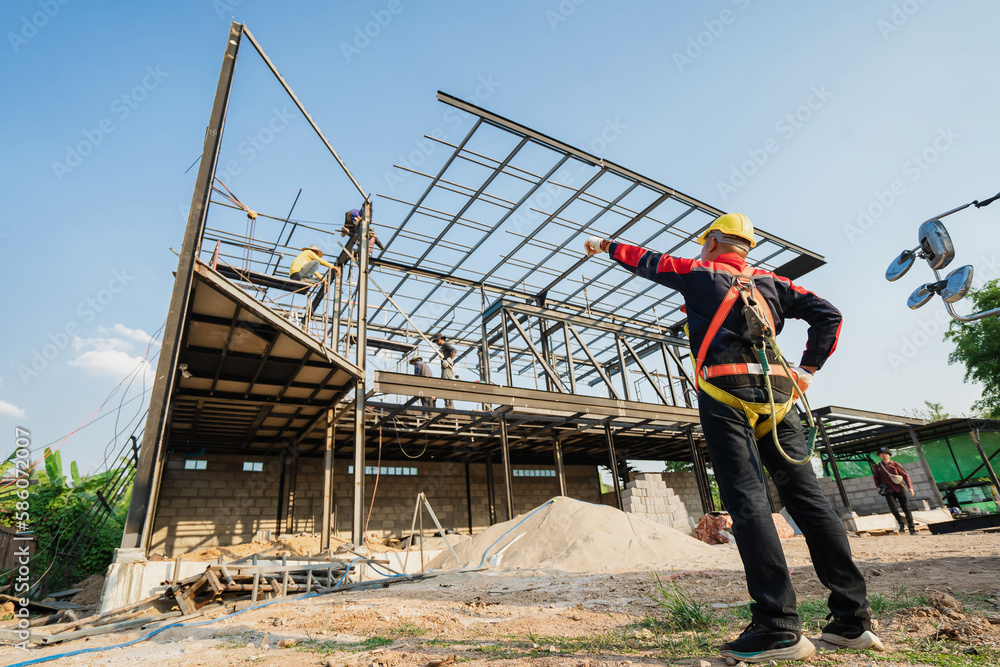 The foreman of steel structure construction works in the construction site. The foreman of steel structure construction works in the construction site.