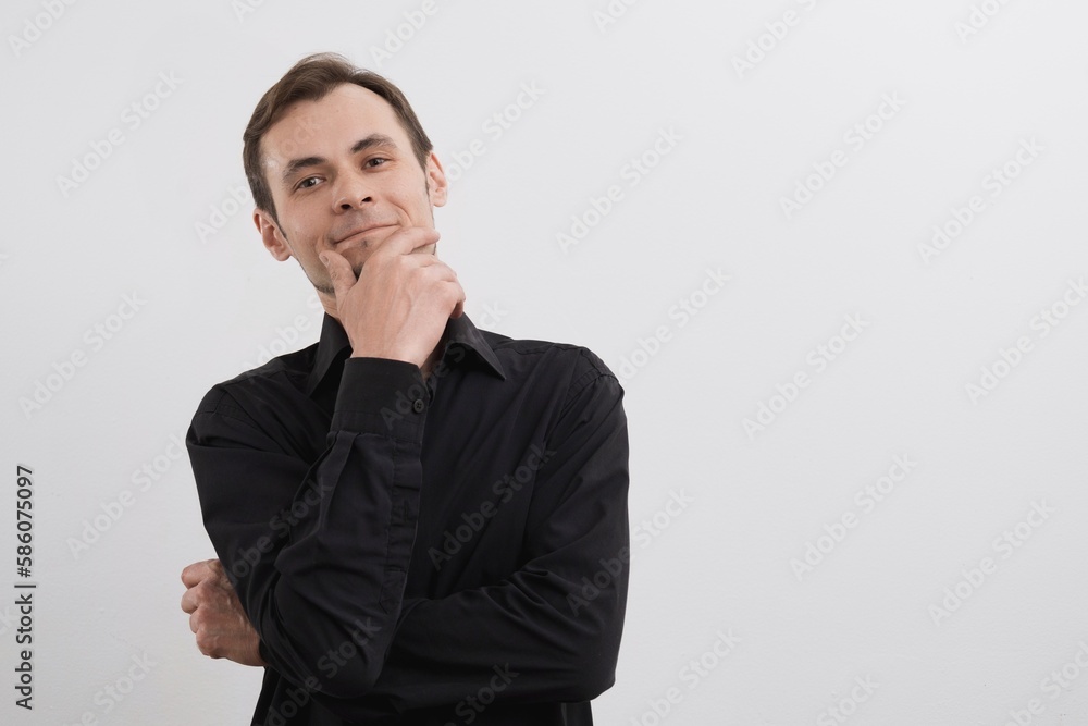 Caucasian man 30s in a black shirt portrait on white background. Caucasian man 30s in a black shirt portrait on white background.