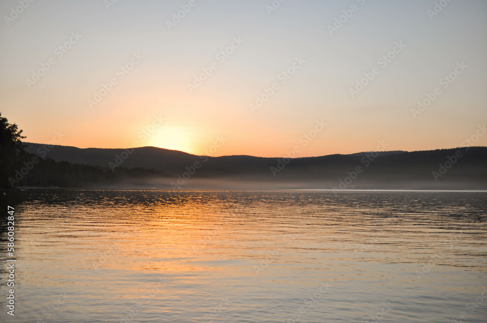 sunrise in the mountains and view of a beautiful lake sunrise in the mountains and view of a beautiful lake