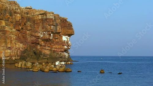 Seascape - rocky cape of Snake Island, sunset lighting. Black Sea, Ukraine. photo