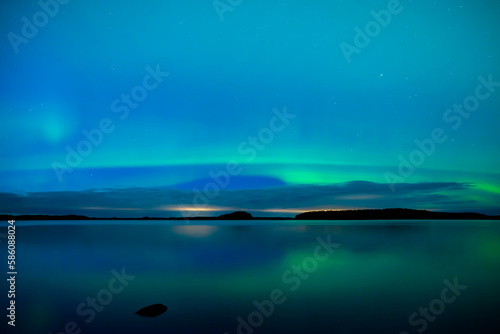 Northern light dancing over the sky in Farnebofjarden national park in north of Sweden. © Conny Sjostrom