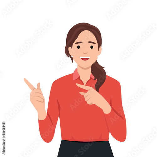Joyful woman pointing finger at copy space.
