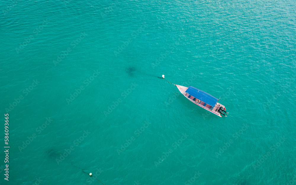 a pink boat at the sea. contains noise and film grain due to High.