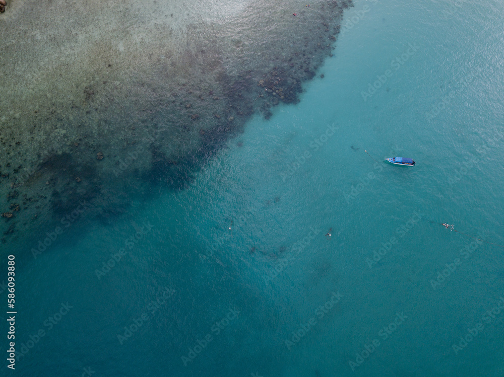 A bot at the sea. contains noise and film grain due to High. A bot at the sea. contains noise and film grain due to High.
