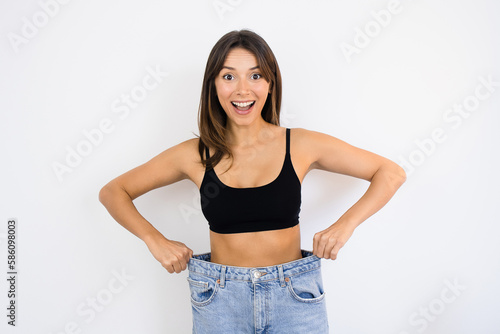 Happy Woman Weight Loss Wearing Old Pair of Jeans Too Big Thin Waist Slim Female Body