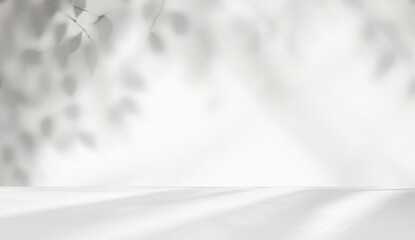 Minimalistic light background with blurred foliage shadow on a white wall. Beautiful background for presentation with with smooth floor.