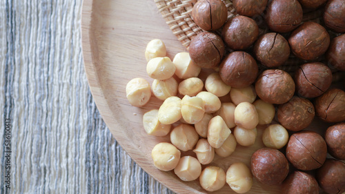 Organic Macadamia nut. macadamia nuts are cracked and baked to taste extremely delicious superfood fresh natural shelled unsalted raw macadamia and healthy food concept