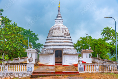 White stupa at Aukana buddha statue site in Sri Lanka photo