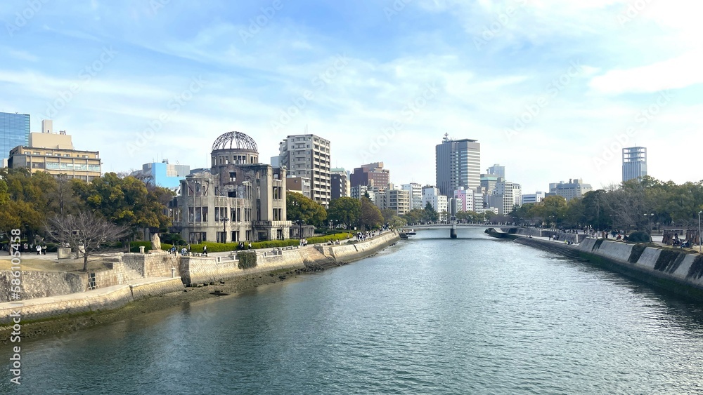 View of the Atomic Bomb Dome beside the flowing Motoyasu river in Hiroshima, Japan