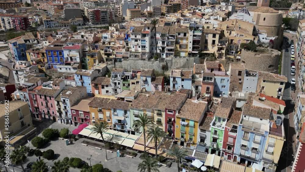 Aerial drone view of La Vila Joiosa.Flying over colorful houses on the Mediterranean coast in the city of La Vila Joiosa in Spain.Costa Blanca. Aerial drone view of La Vila Joiosa.Flying over colorful houses on the Mediterranean coast in the city of La Vila Joiosa in Spain.Costa Blanca.