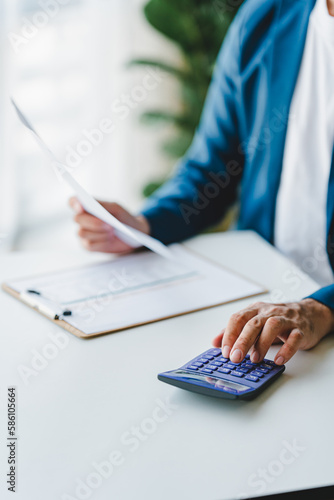 Canvas Print Close-up of business people working on taxes, financial accounting calculations,