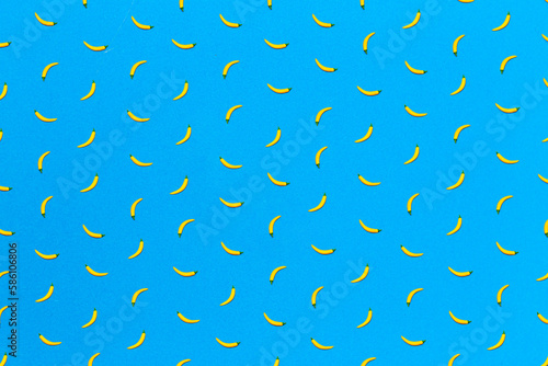 Hot yellow peppers on a blue background. Creative vegetable concept