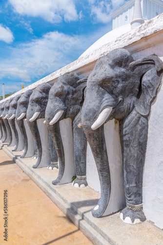 Statues of elephants at Ruwanweli Maha Seya stupa built in Anuradhapura, Sri Lanka photo