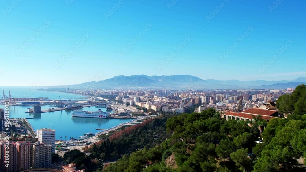 Drone takes off and rises to reveal stunning aerial overview of Malaga Spain Drone takes off and rises to reveal stunning aerial overview of Malaga Spain