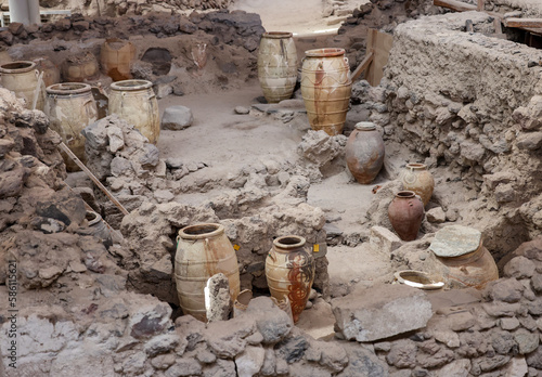 Recovered ancient pottery in prehistoric town of Akrotiri, excavation site of a Minoan Bronze Age settlement on the Greek island of Santorini photo