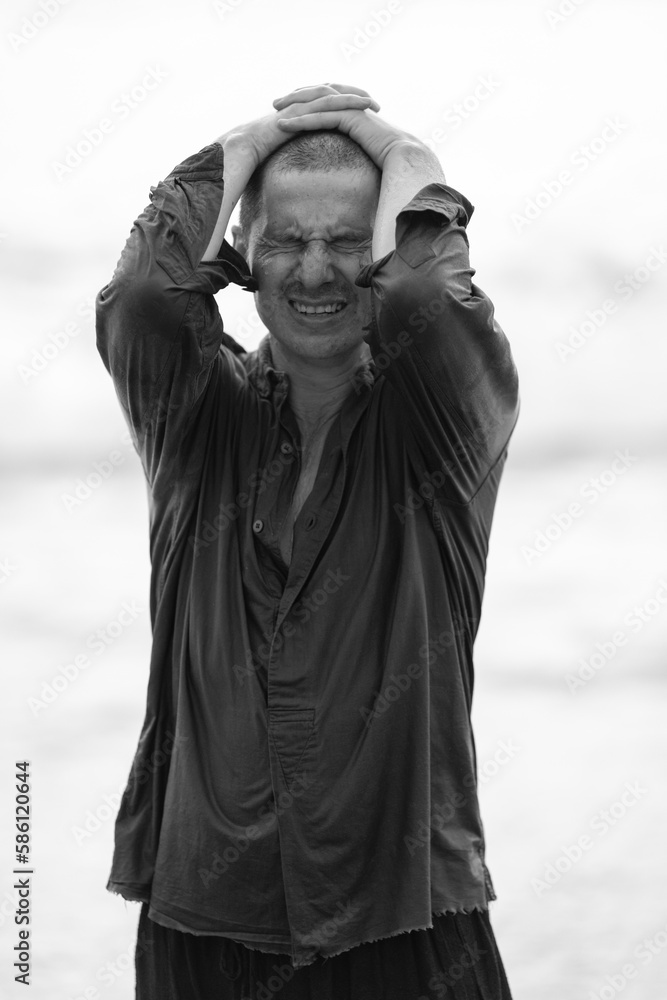 The man has hair after a hair transplant operation on his head. He is showing The man has hair after a hair transplant operation on his head. He is showing