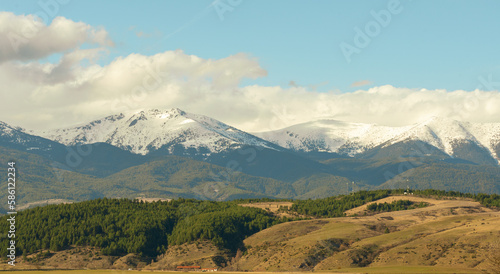 Beautiful panoramic landscape of snow-capped Rila mountains in March near Bansko