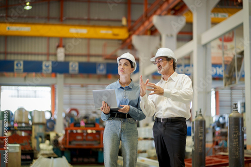 A new generation of engineers in a metal sheet factory.  Studying work methods from supervisors or colleagues and studying by yourself  be taught professionally