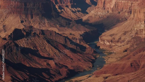 Gorge of Colorado river in Grand canyon national park with red orange butte rock formations in sunset light, panorama from bottom to top. Amazing views of most famous place made by nature, Arizona USA
