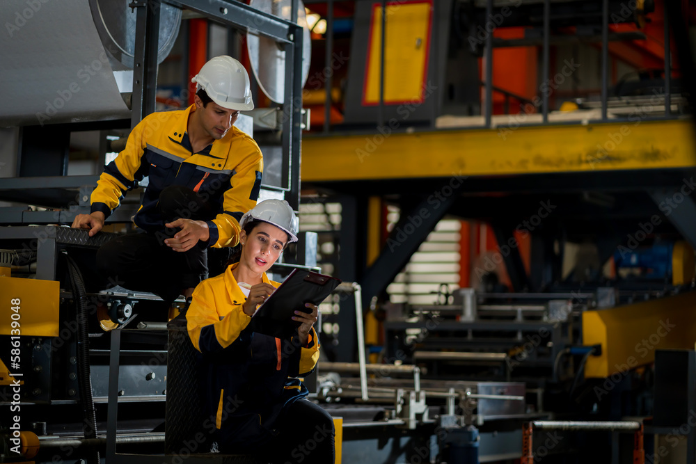 A new generation of engineers in a metal sheet factory.  Studying work methods from supervisors or colleagues and studying by yourself  be taught professionally