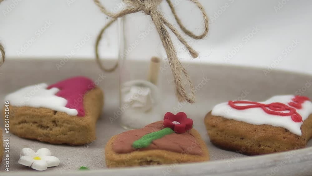 Colorful heart-shaped cookies in a plate served for a fancy party on a buffet table. Close up Colorful heart-shaped cookies in a plate served for a fancy party on a buffet table. Close up